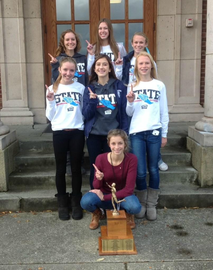 The winners pose by their state trophy.