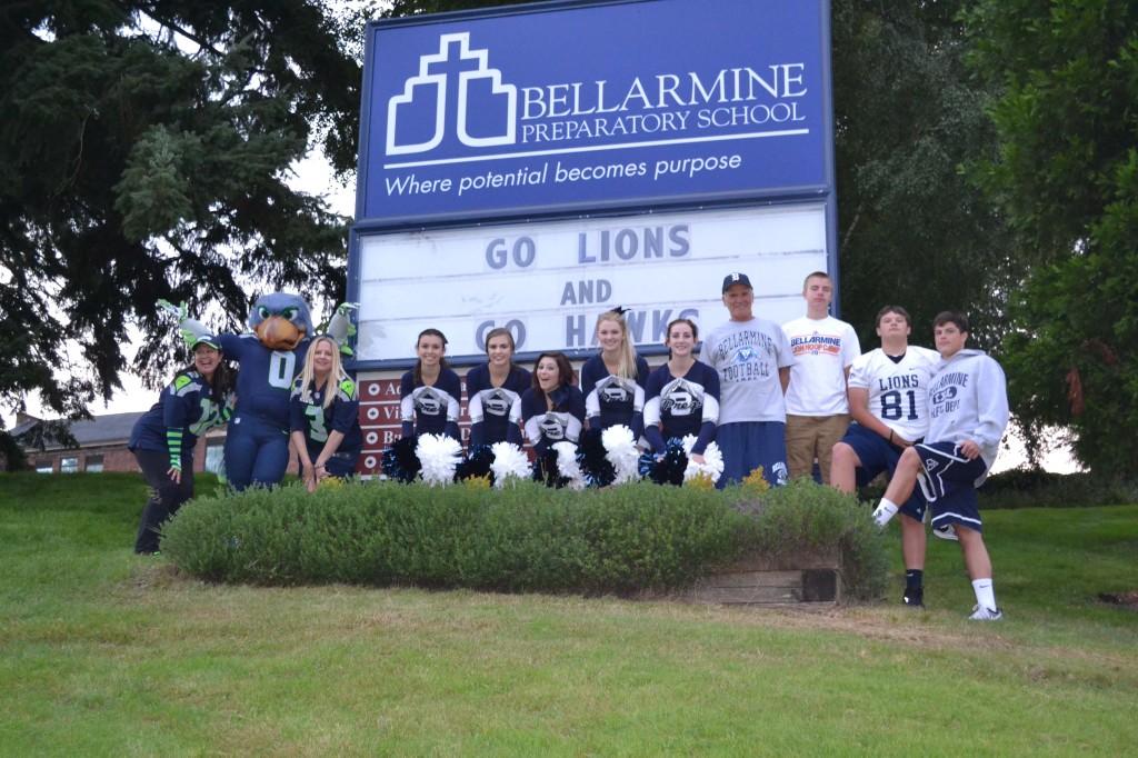 Cheerleaders and Seahawks Blitz join Fr. Gerry Chapdelaine, S.J. and three C-team football players who have played and won together since 3rd grade. Photo by Jeanne Hanigan