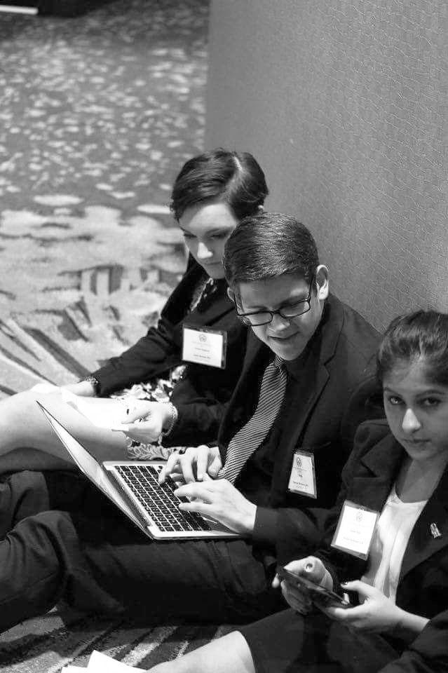 Students work together at the Model UN conference. Photo courtesy of Alec Ilstrup Media