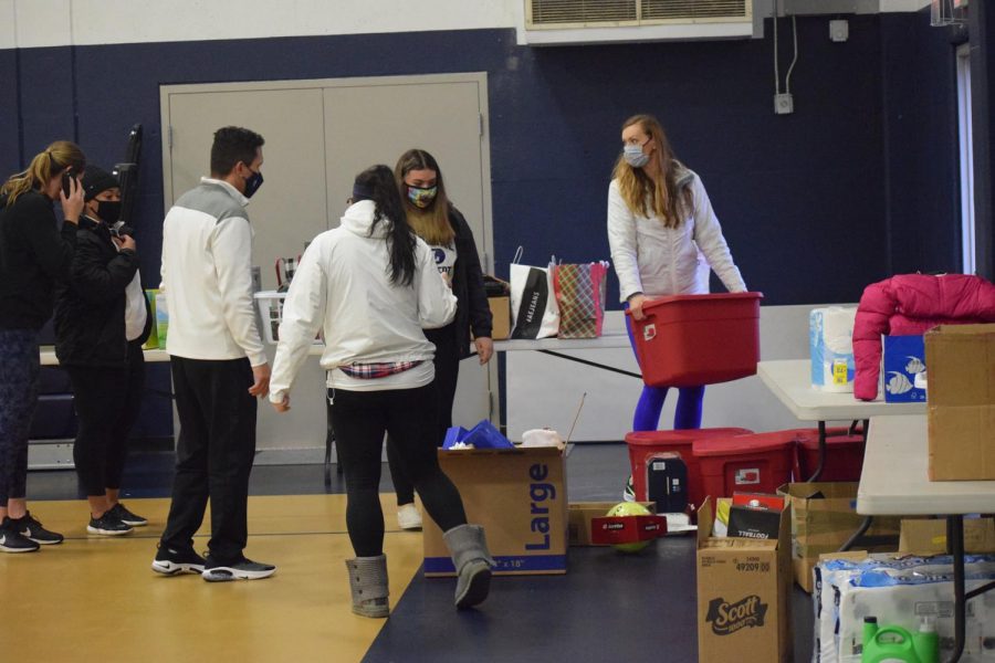 AAF Coordinator Julie Hiles enlists the help of her colleagues and family to load items.