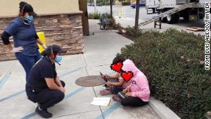 Two children outside a Taco Bell in Salinas, California using the free WiFi to do schoolwork. The poster of this image obscured the faces of these children pictured (cnn.com).