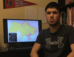 Noah Wilson looks very serious next to a map of the Russo-Ukrainian War