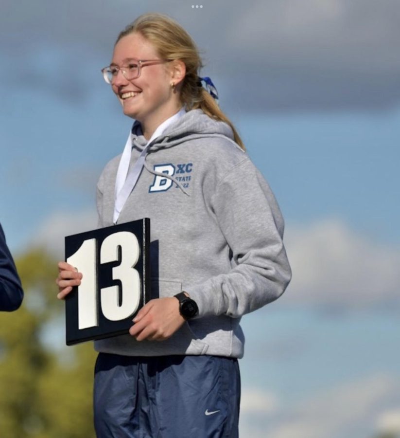 Josephine Stevenson poses with her medal for 13th place overall.