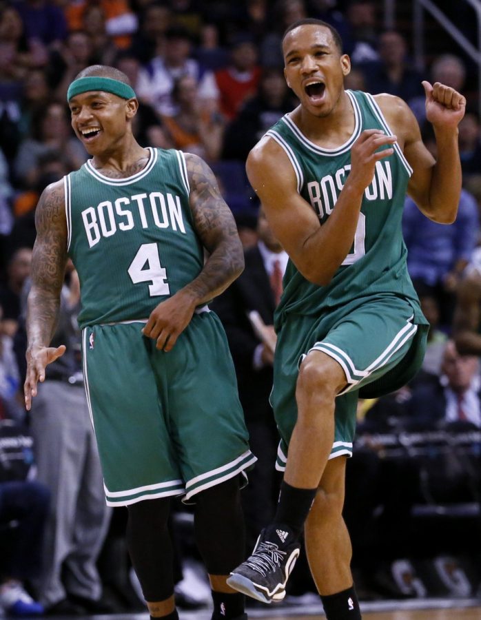Boston Celtics Isaiah Thomas (4) and Avery Bradley celebrate a basket against the Phoenix Suns during the second half of an NBA basketball game Monday, Feb. 23, 2015, in Phoenix. (Bradley attended Bellarmine from 2005-2008.)