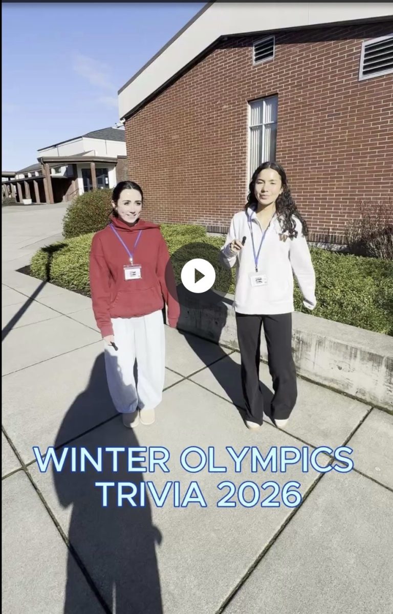 Ellie Rehberger and Cori Joyce quiz students/staff on Winter Olympics trivia.  Photo courtesy of Ellie Rehberger