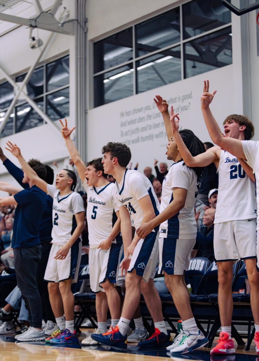 The Boys Basketball team rejoices at one of the the home games. Photo courtesy of Instagram @malimaksmedia
