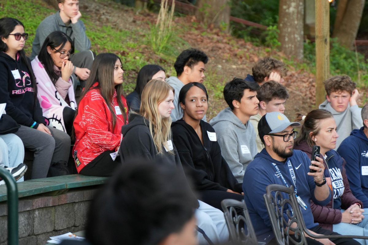 Students and staff reflect at SEEK, the sophomore retreat. Photo courtesy of Melissa Echeverria